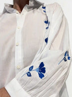 Camicia cotone bianca ricami floreali blu