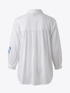 Camicia cotone bianca ricami floreali blu
